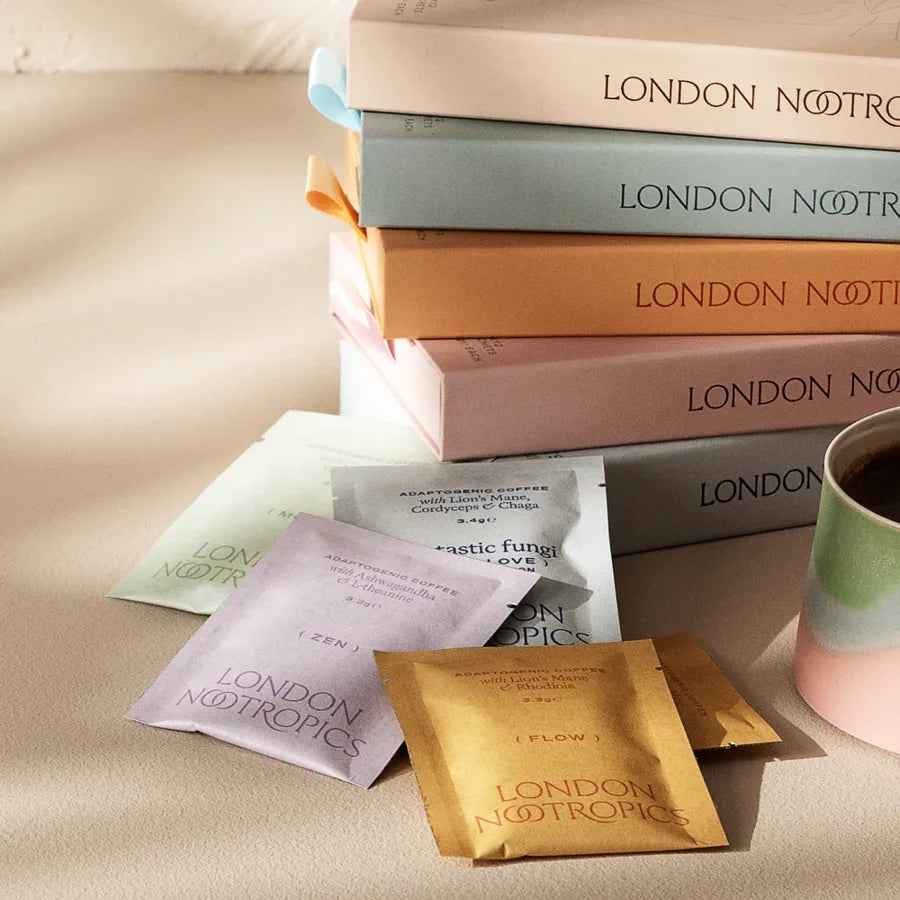 London Nootropics boxes stacked with Zen and Flow sachets and a cup of coffee